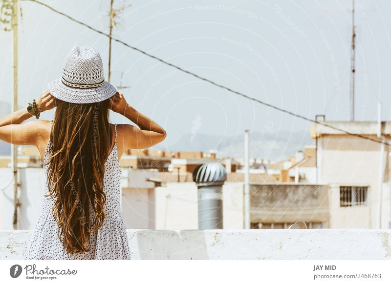 woman with hat looking at the city on the skyline, from behind Lifestyle Happy Beautiful Vacation & Travel Tourism Summer Human being Woman Adults Landscape Sky