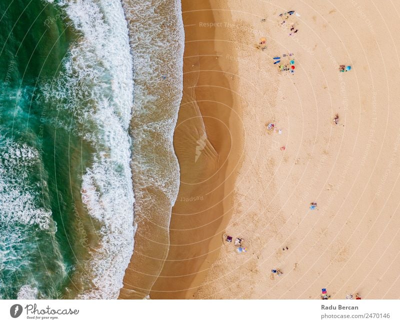 Aerial View From Flying Drone Of People Crowd Relaxing On Algarve Beach In Portugal Aircraft Vantage point Sand Background picture Water Above Ocean
