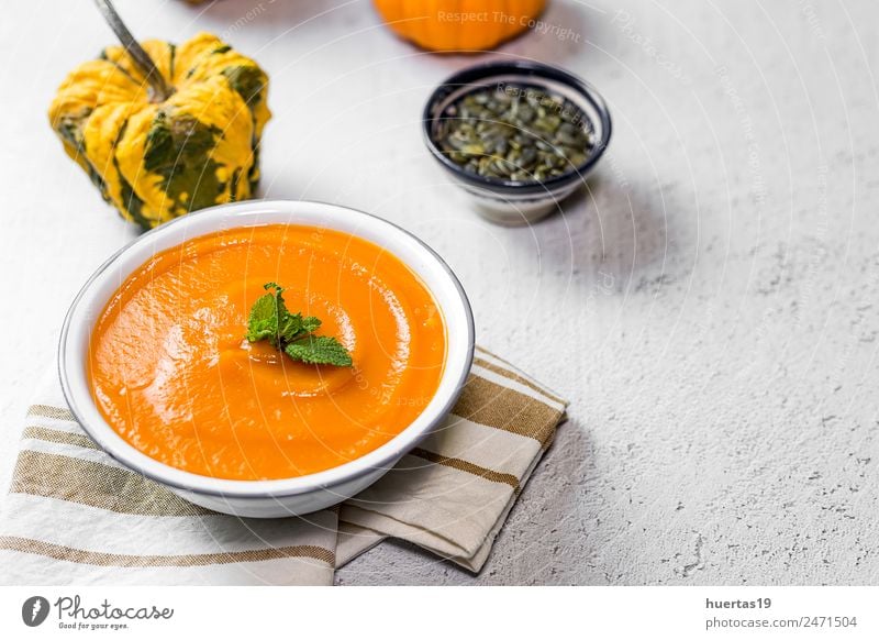 Cream of pumpkin in bowl Food Vegetable Soup Stew Dinner Vegetarian diet Diet Plate Bowl Spoon Elegant Style Healthy Healthy Eating Autumn Sour Yellow Tradition