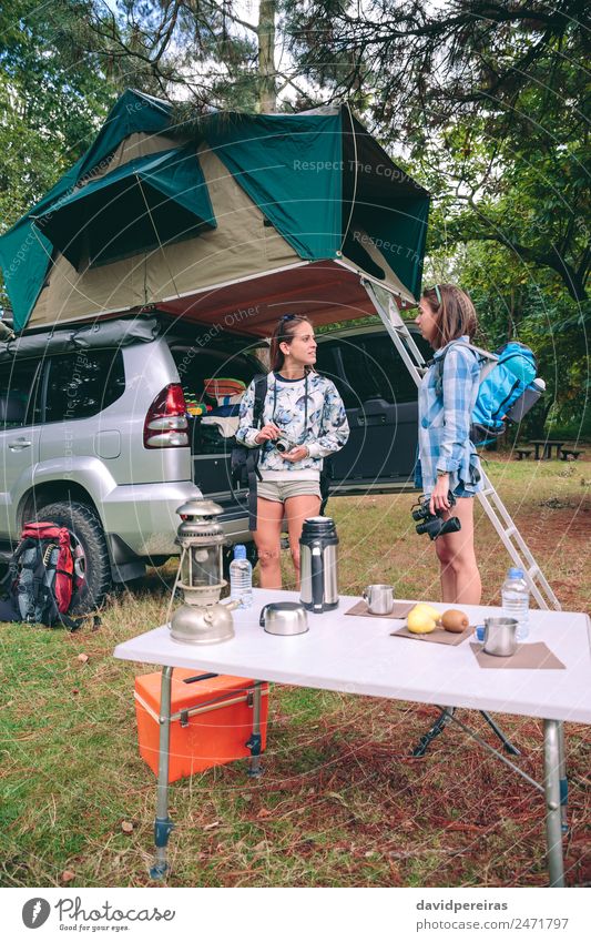 Young women ready for hiking trip with 4x4 on background Coffee Lifestyle Joy Happy Relaxation Leisure and hobbies Vacation & Travel Trip Adventure Camping