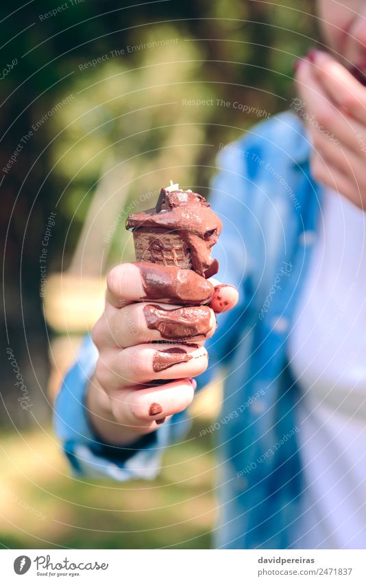 Young woman eating chocolate ice cream in forest Ice cream Lifestyle Leisure and hobbies Camping Summer Mountain Human being Woman Adults Hand Fingers Nature