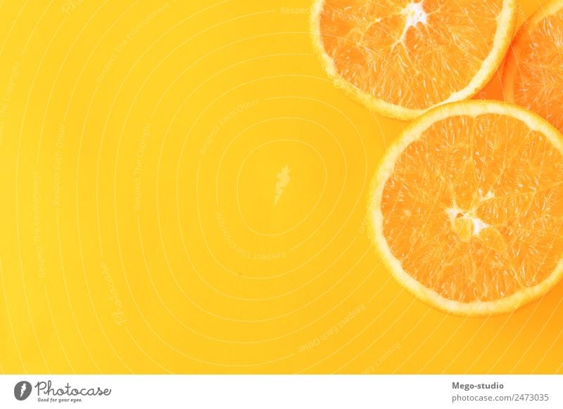 orange slices on yellow background. Fruit Dessert Eating Vegetarian diet Diet Juice Exotic Nature Fresh Natural Juicy Yellow White Colour isolated citrus Slice