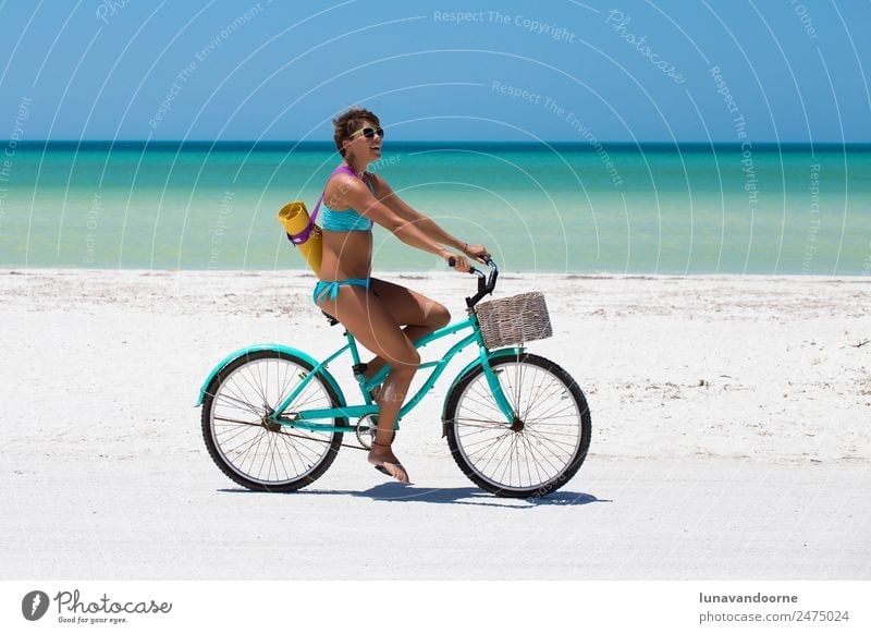 Woman biking on the beach with a yoga mat Lifestyle Joy Leisure and hobbies Freedom Cycling tour Summer Beach Sports Yoga 1 Human being 18 - 30 years