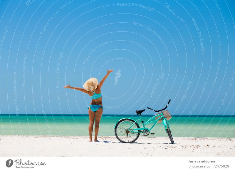 Woman and a bike on the beach Lifestyle Joy Beautiful Leisure and hobbies Vacation & Travel Freedom Summer Beach Cycling Human being Adults Arm Nature Sand Sky