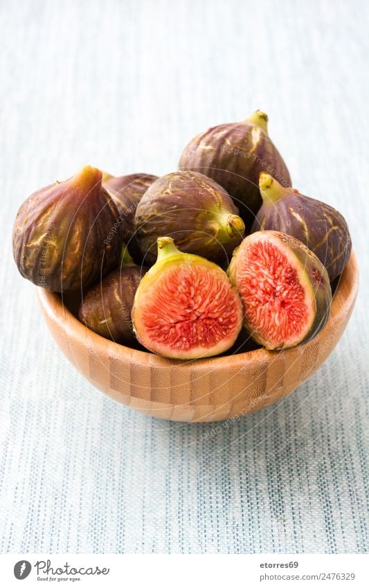 Fresh figs in bowl on blue background Fig Fruit Food Healthy Eating Food photograph antioxidant Raw Sweet Tropical Vitamin Bowl Blue