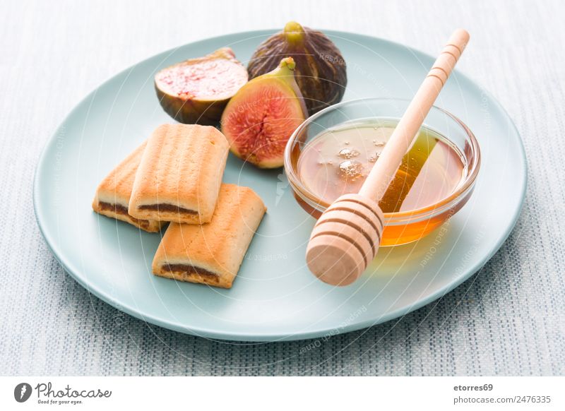 figs cookies and honey on blue background Food Fruit Cake Dessert Nutrition Organic produce Vegetarian diet Diet Blue Yellow Red Fig Cookie Honey Sweet