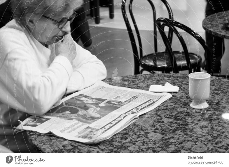 Grandma in the Bistro Grandmother Senior citizen Newspaper Reading Sidewalk café Bar Restaurant Drinking Beverage Woman Female senior Loneliness