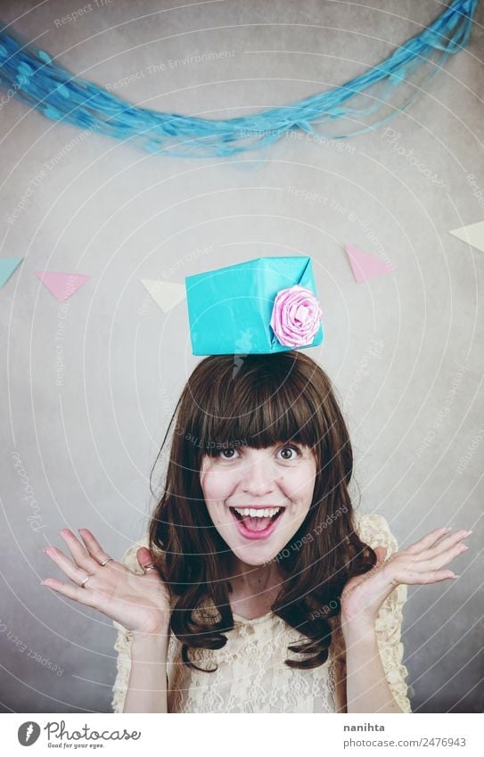 Young cheerful woman with a gift over her head Lifestyle Style Wellness Well-being Party Event Feasts & Celebrations Birthday Human being Feminine Young woman