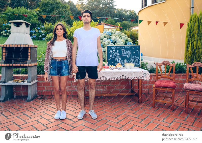 Couple standing in a outdoors summer barbecue Bread Roll Lunch Fast food Beverage Lemonade Lifestyle Joy Relaxation Summer Garden Table Blackboard Human being