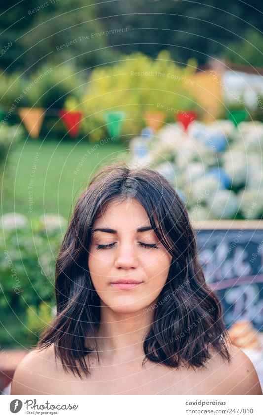 Portrait of woman with closed eyes in garden Lifestyle Beautiful Calm Meditation Leisure and hobbies Summer Garden Blackboard Human being Woman Adults Nature