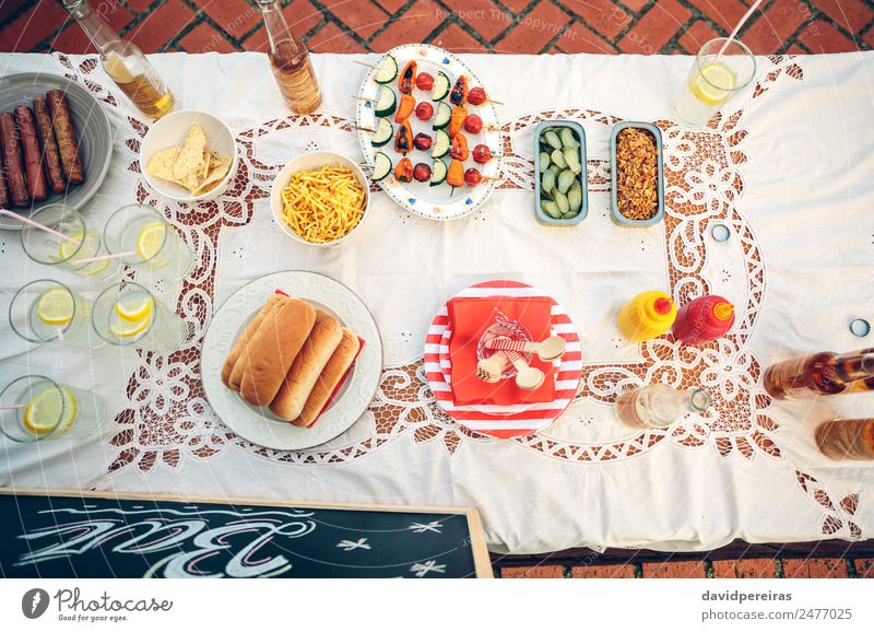 Table with food and drinks in summer party Vegetable Bread Roll Lunch Fast food Beverage Lemonade Beer Plate Bottle Happy Summer To enjoy Fresh Delicious Yellow