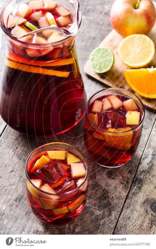 Sangria drink in glass on wood sangria Beverage Drinking Summer Alcoholic drinks Red Fruit Spanish Orange Apple Lemon Lime Delicious Refreshment Cold Ice
