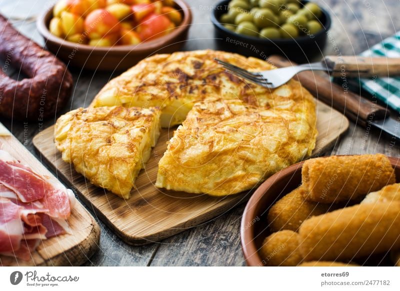 Spanish tapas Food Sausage Fish Vegetable Lunch Dinner Banquet Bowl Fork Good Brown Yellow Green Omelette Tapas Flat bread Olive Potatoes patatas bravas