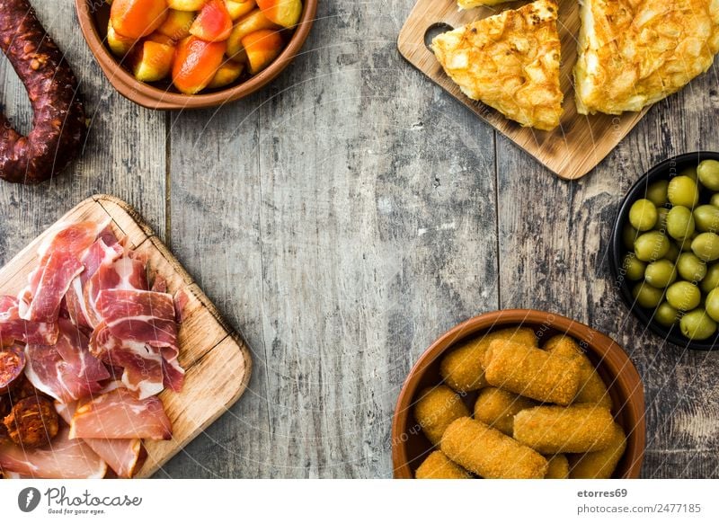 Traditional spanish tapas top view Food Sausage Cheese Bowl Healthy Eating Table Wood Delicious Tapas Spanish patatas bravas Food photograph Croquettes Olive