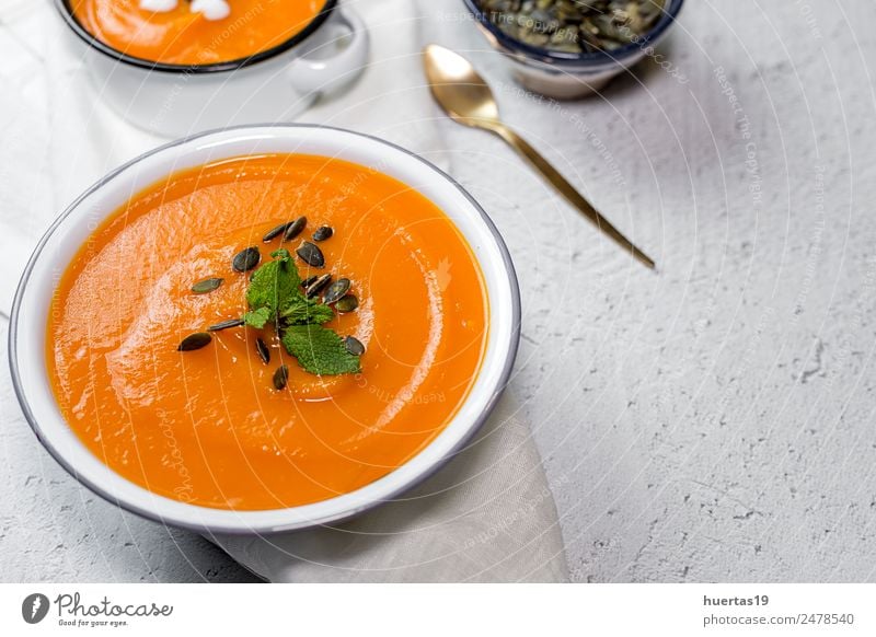 Cream of pumpkin in bowl. Food Vegetable Soup Stew Dinner Vegetarian diet Diet Plate Bowl Spoon Healthy Healthy Eating Autumn Delicious Sour Yellow Tradition