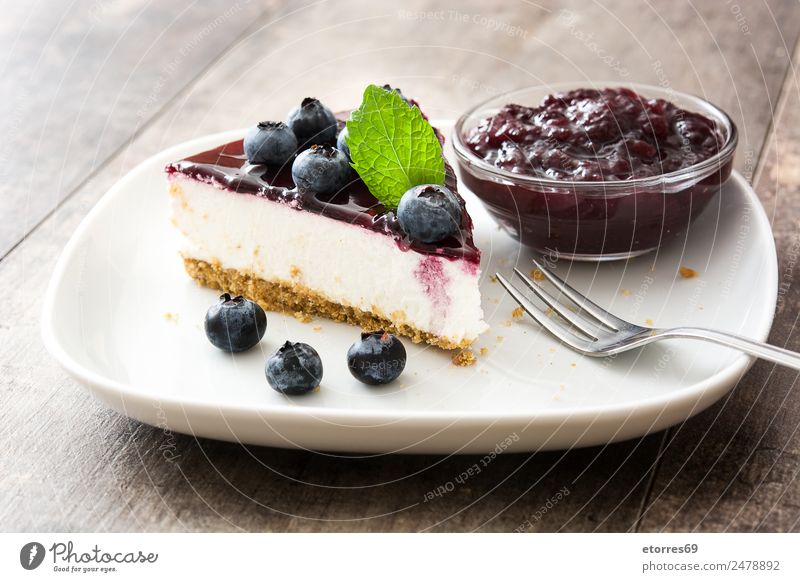 Piece of blueberry cheesecake Cheese Blueberry Baked goods Cake Dessert Fruit Sweet Candy Food Healthy Eating Food photograph Baking Creamy Home-made Wood Table