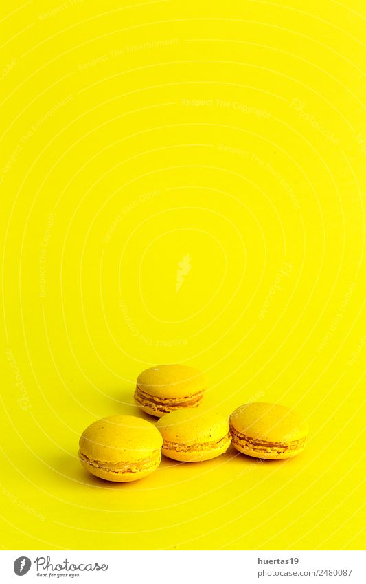 Delicious macaron with yellow background Food Dessert Sour Yellow Colour Macaron isolated cake sweet colorful french biscuit Bakery candy snack sugar Gourmet