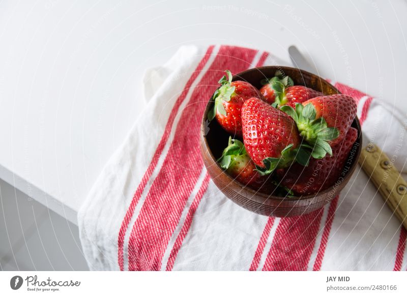 Strawberries in wooden bowl on dishtowel Food Fruit Dessert Nutrition Breakfast Diet Bowl Summer Table Group Fresh Delicious Natural Above Brown Red Strawberry