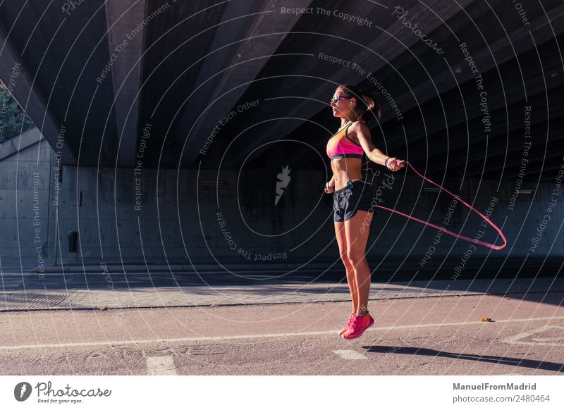 athletic woman jumping with skipping rope Lifestyle Joy Beautiful Body Healthy Health care Athletic Fitness Wellness Well-being Leisure and hobbies Jump rope