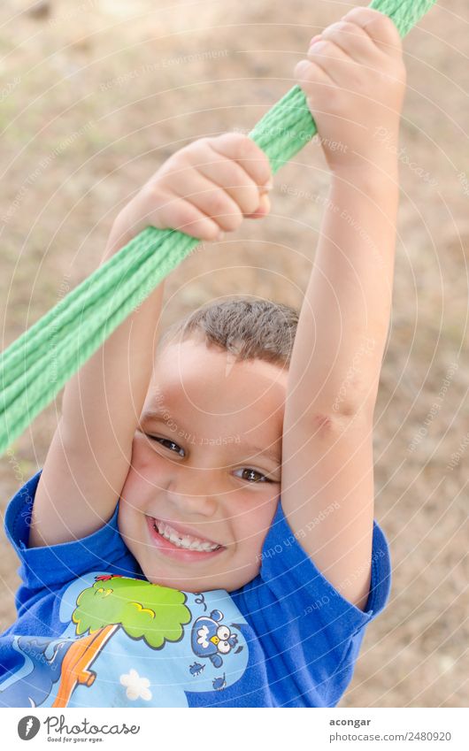 Boy having fun, holding on to a rope. Joy Happy Beautiful Face Climbing Mountaineering Child Rope Human being Boy (child) 1 3 - 8 years Infancy To enjoy Funny