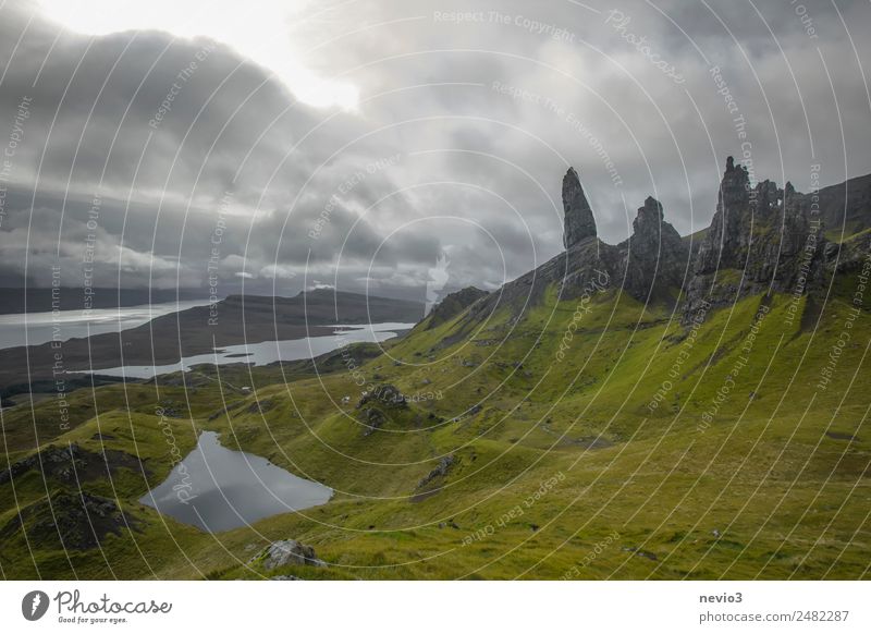 Old Man of Storr on the Isle of Skye in Scotland Landscape Summer Autumn Grass Hill Rock Mountain Green Grassland Island fog Wall of rock Lake Bay Weather Idyll