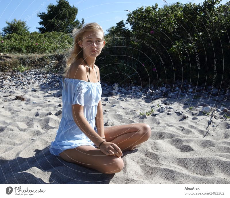 Young woman in front of beach dune Lifestyle Joy pretty Summer vacation Sun Sunbathing Beach Ocean Youth (Young adults) Legs 18 - 30 years Adults Landscape