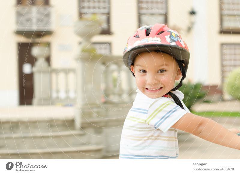 A funny boy riding his bicycle Joy Happy Beautiful Face Cycling Child Human being Masculine Boy (child) Infancy 1 3 - 8 years To enjoy Happiness Fresh Funny