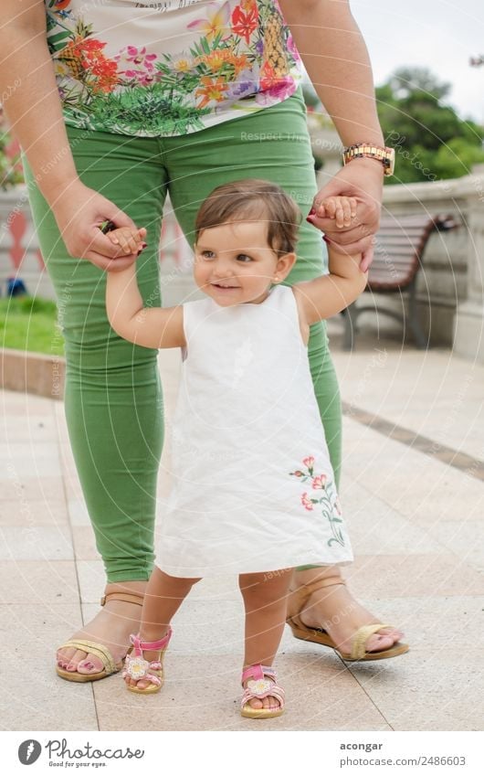 One year old girl learning to walk Happy Beautiful Face Child Human being Feminine Baby Girl Infancy Hand 1 0 - 12 months 1 - 3 years Toddler Dress Smiling