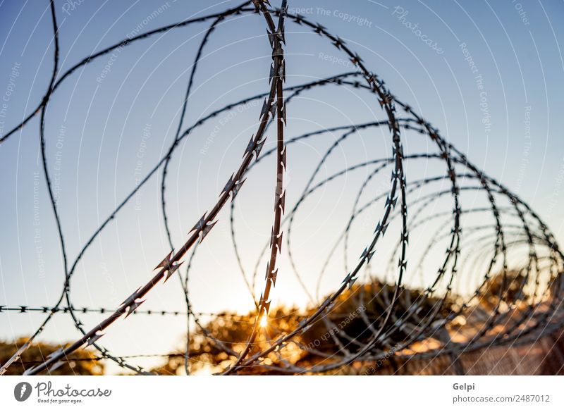 Fence with a barbed Freedom Camping Sky Metal Steel Rust Line Blue Black White Safety Protection Safety (feeling of) Dangerous War wire Penitentiary sharp