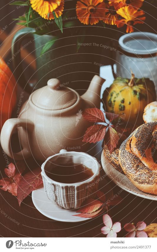 cozy autumn breakfast on table in country house Breakfast Beverage Tea Pot Lifestyle Decoration Table Autumn Warmth Leaf Forest Safety (feeling of) fall Bagel