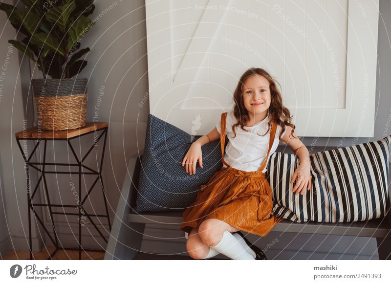 happy kid girl relaxing in new house. Lifestyle Happy Flat (apartment) House (Residential Structure) Moving (to change residence) Decoration Living room Child