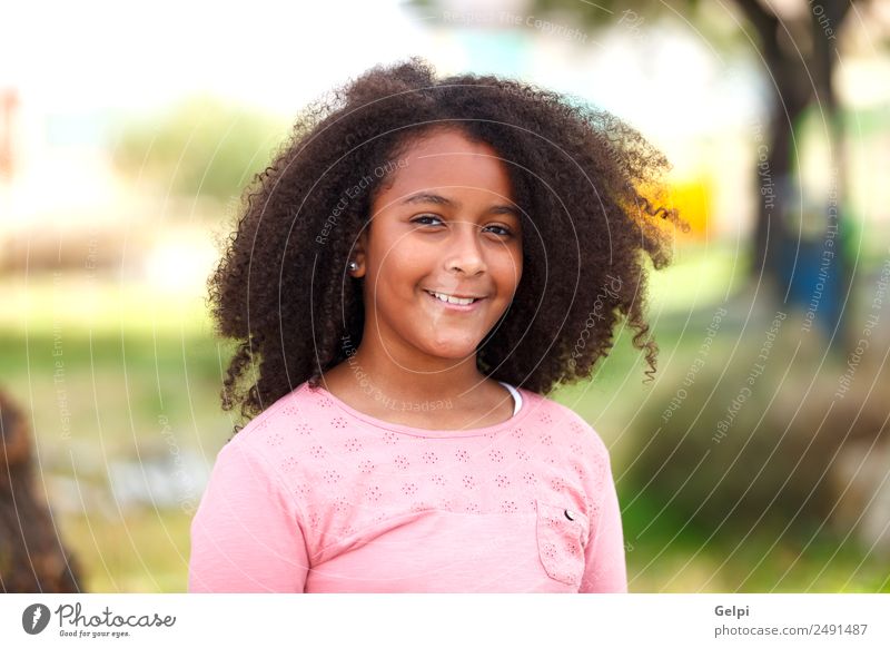 Pretty girl with long afro hair - a Royalty Free Stock Photo from Photocase