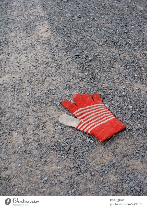 disassociated Clothing Gloves Lie Dirty Gray Red White Emotions Sadness Loneliness Disappointment Divide Lose Lanes & trails Gravel path Striped Reddish white