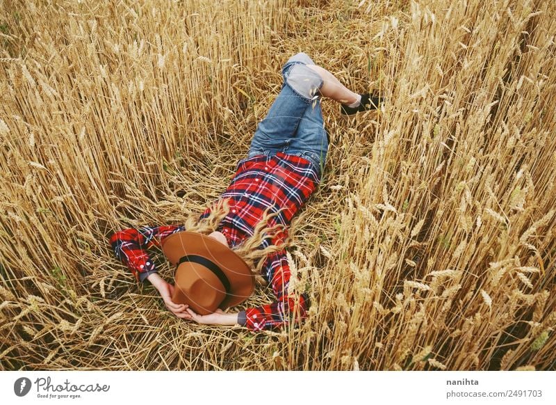 Young woman sleeping in a wheat field Lifestyle Style Design Joy Wellness Relaxation Vacation & Travel Adventure Freedom Summer Summer vacation Agriculture
