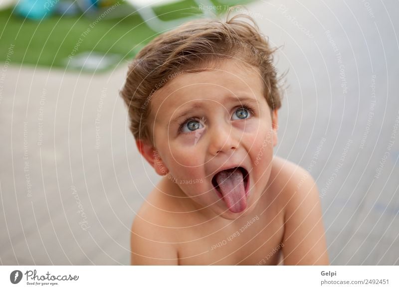 Beautiful baby two years old outside showing his tongue Lifestyle Joy Happy Skin Face Summer Child Human being Baby Toddler Boy (child) Man Adults Infancy