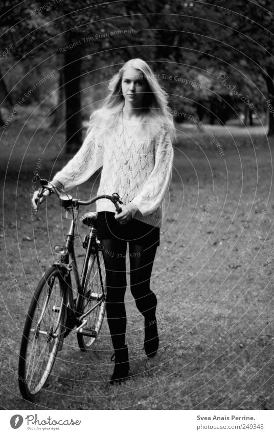 bicycle. Feminine Young woman Youth (Young adults) 1 Human being 18 - 30 years Adults Tree Park Meadow Skirt Sweater Long-haired Bicycle To hold on Thin Push