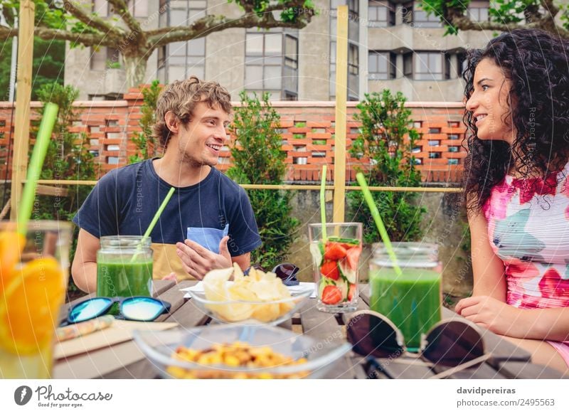 Young couple having fun in a summer day Vegetable Fruit Beverage Lifestyle Joy Happy Beautiful Leisure and hobbies Vacation & Travel Summer Garden Table To talk