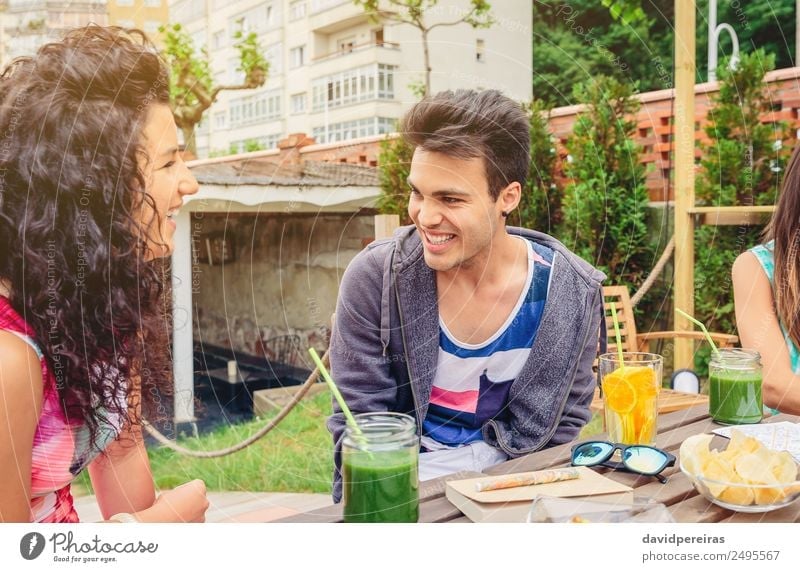 Young couple having fun in a summer day Vegetable Fruit Beverage Lifestyle Joy Happy Beautiful Leisure and hobbies Vacation & Travel Summer Garden Table To talk