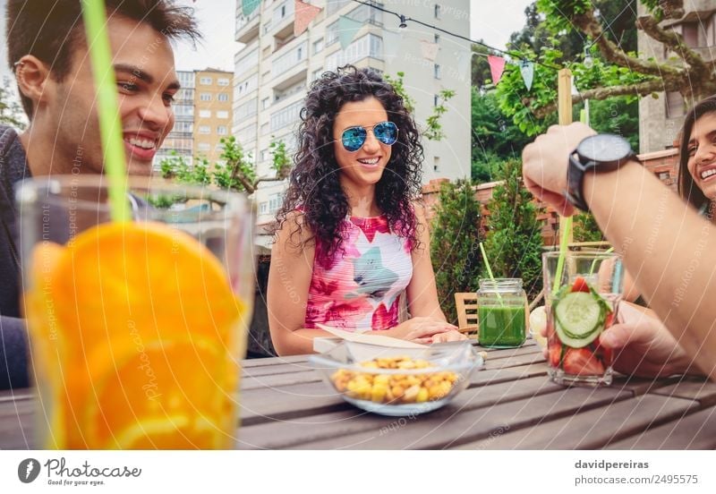 Young woman talking with friends in a summer day Vegetable Fruit Beverage Lifestyle Joy Happy Beautiful Leisure and hobbies Vacation & Travel Summer Garden