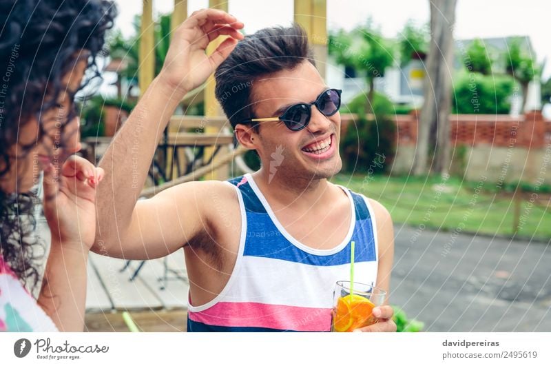 Happy man with sunglasses laughing in summer party Vegetable Fruit Beverage Alcoholic drinks Lifestyle Joy Leisure and hobbies Summer Garden Music Dance