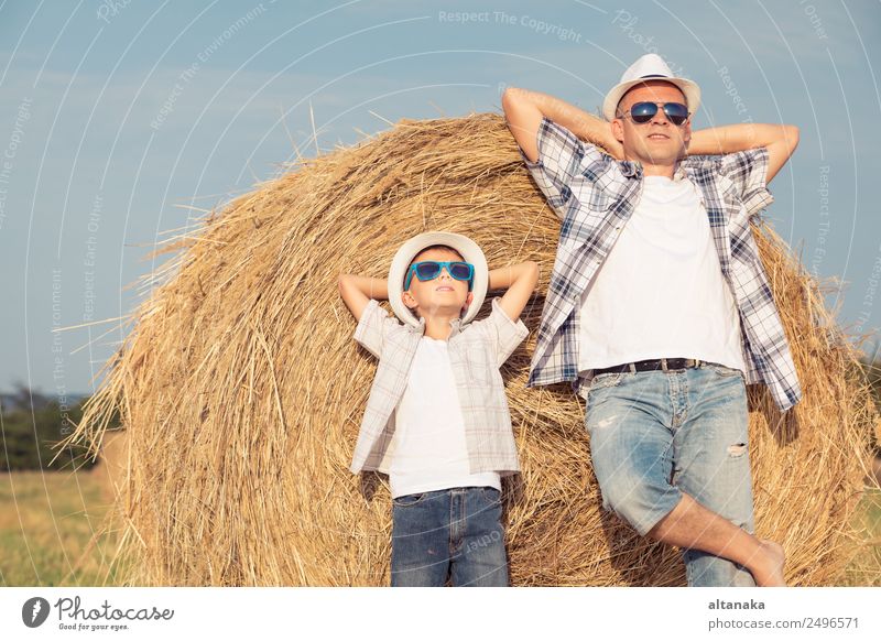 Father and son playing in the park Lifestyle Joy Happy Leisure and hobbies Playing Vacation & Travel Freedom Summer Sun Sports Child Human being Boy (child) Man