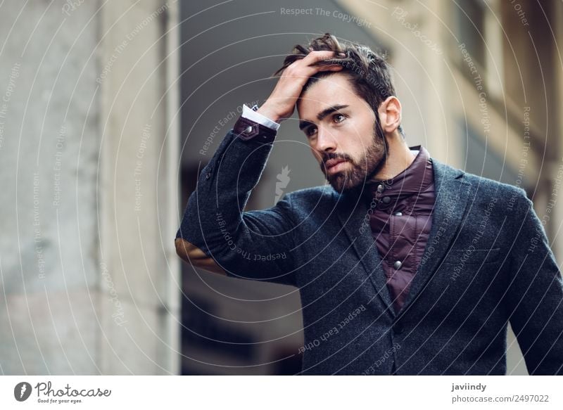 Young bearded man, model of fashion, in urban background wearing british elegant suit. Lifestyle Elegant Style Beautiful Hair and hairstyles Human being