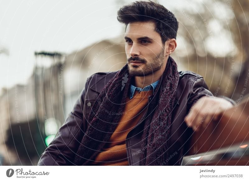 Thoughtful young man sitting on an urban bench Lifestyle Style Beautiful Hair and hairstyles Human being Masculine Young man Youth (Young adults) Man Adults 1