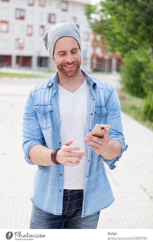 Casual guy Lifestyle Style Joy Happy Leisure and hobbies Telephone PDA Technology Human being Man Adults Street Fashion Shirt Hat Beard Listening Smiling Write