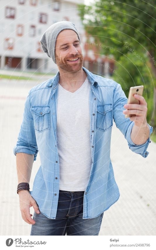 Casual guy Lifestyle Style Joy Happy Leisure and hobbies Telephone PDA Technology Human being Man Adults Street Fashion Shirt Hat Beard Listening Smiling Write