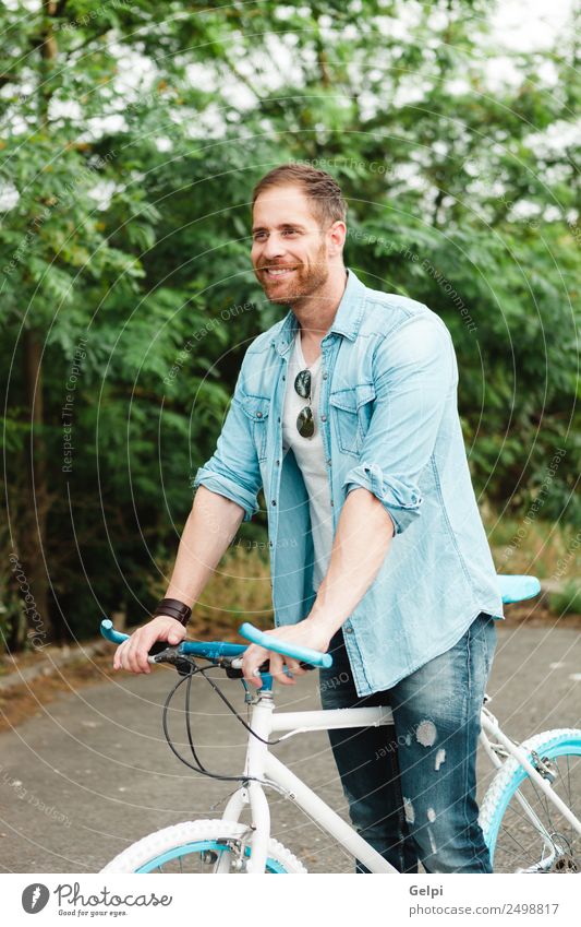 Casual guy Lifestyle Joy Happy Leisure and hobbies Vacation & Travel Summer Sports Cycling Human being Man Adults Nature Park Transport Street To enjoy Smiling