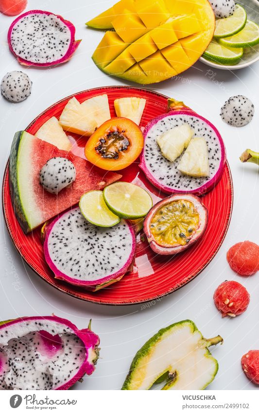 Various tropical fruits on a red plate Food Fruit Dessert Nutrition Breakfast Organic produce Vegetarian diet Diet Plate Style Design Healthy Eating Summer