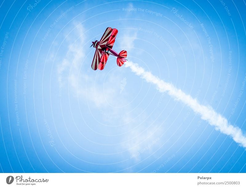 Red plane with propeller flying upward with white smoke Vacation & Travel Summer Pilot Environment Sky Wind Transport Airplane Biplane Aircraft Old Flying