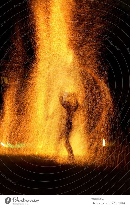 Man in the middle of fire and rain of sparks Human being Fire shower of sparks Test of courage Brave Threat Spark Burn Blaze Flame Night Silhouette Hot Survive