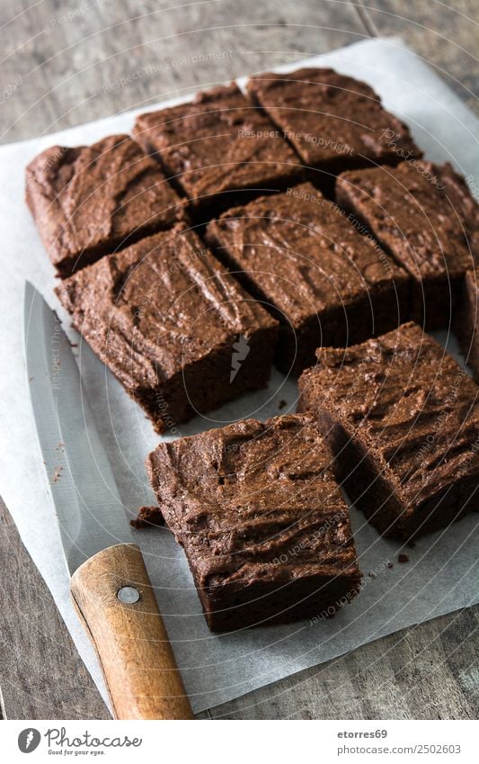 Chocolate brownie portions on wood Food Cake Dessert Candy Nutrition Organic produce Vegetarian diet Knives Wood Brown Baked goods Sweet Food photograph Snack